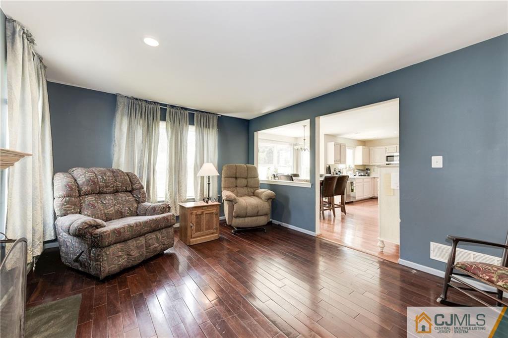 25 Crescent Road Old Bridge, NJ 08857 - Photo 14 of 25 a living room with furniture and a wooden floor