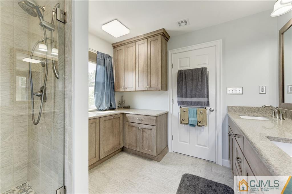 25 Crescent Road Old Bridge, NJ 08857 - Photo 17 of 25 a bathroom with a tub sink and mirror