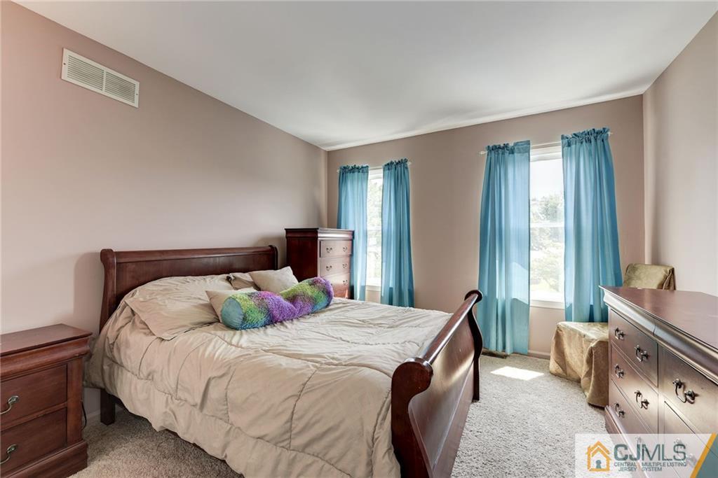 25 Crescent Road Old Bridge, NJ 08857 - Photo 19 of 25 a bedroom with a bed and a window
