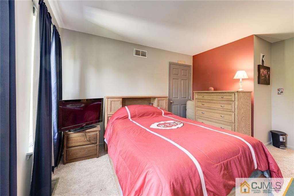 25 Crescent Road Old Bridge, NJ 08857 - Photo 21 of 25 a bedroom with a bed and a closet