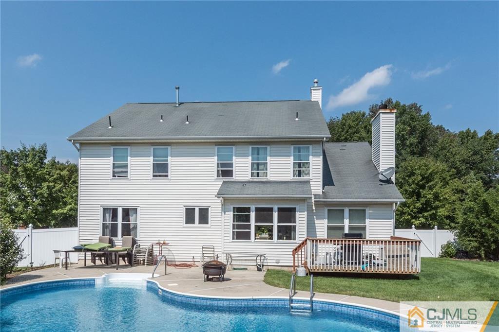 25 Crescent Road Old Bridge, NJ 08857 - Photo 22 of 25 a front view of a house with swimming pool and sitting area