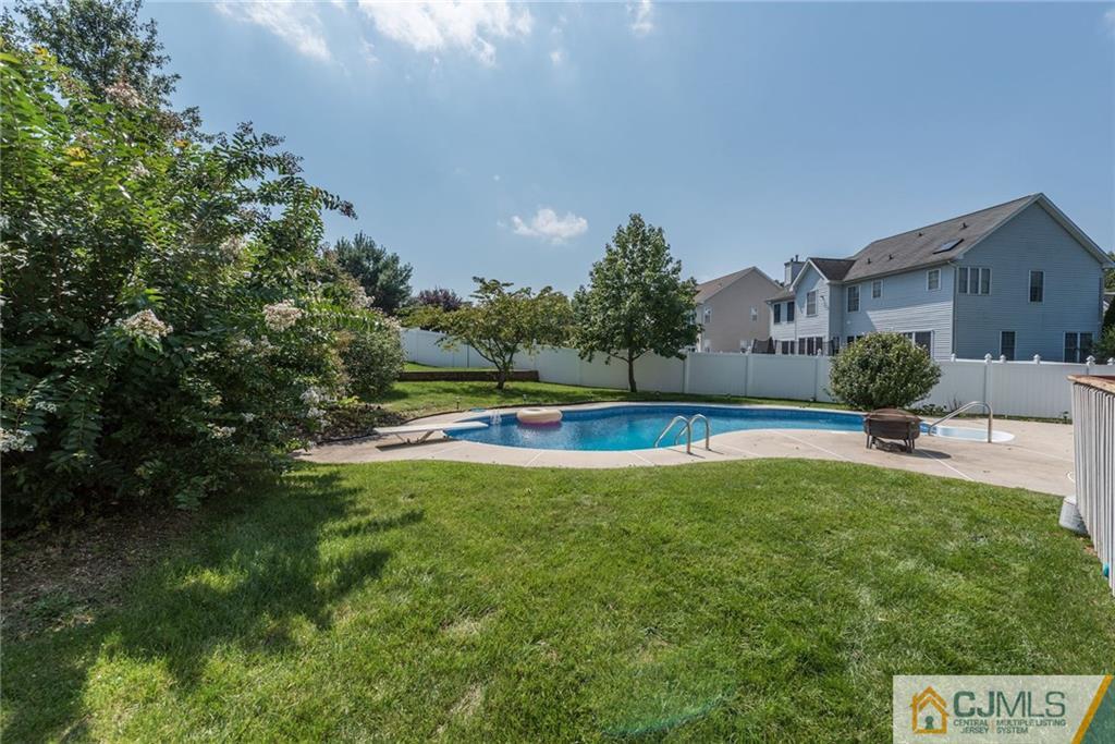25 Crescent Road Old Bridge, NJ 08857 - Photo 24 of 25 a view of a swimming pool with a yard and plants