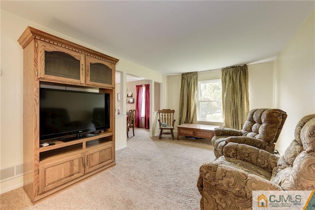 25 Crescent Road Old Bridge, NJ 08857 - Photo 7 of 25 a living room with furniture and a flat screen tv