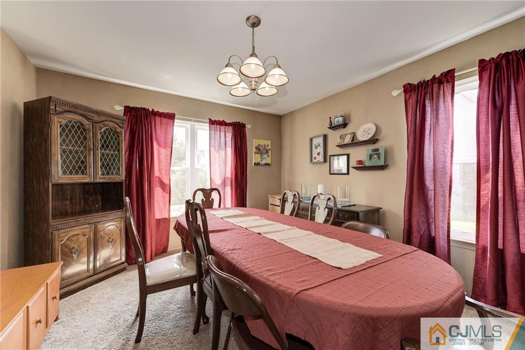 25 Crescent Road Old Bridge, NJ 08857 - Photo 8 of 25 a view of a dining room with furniture window and wooden floor
