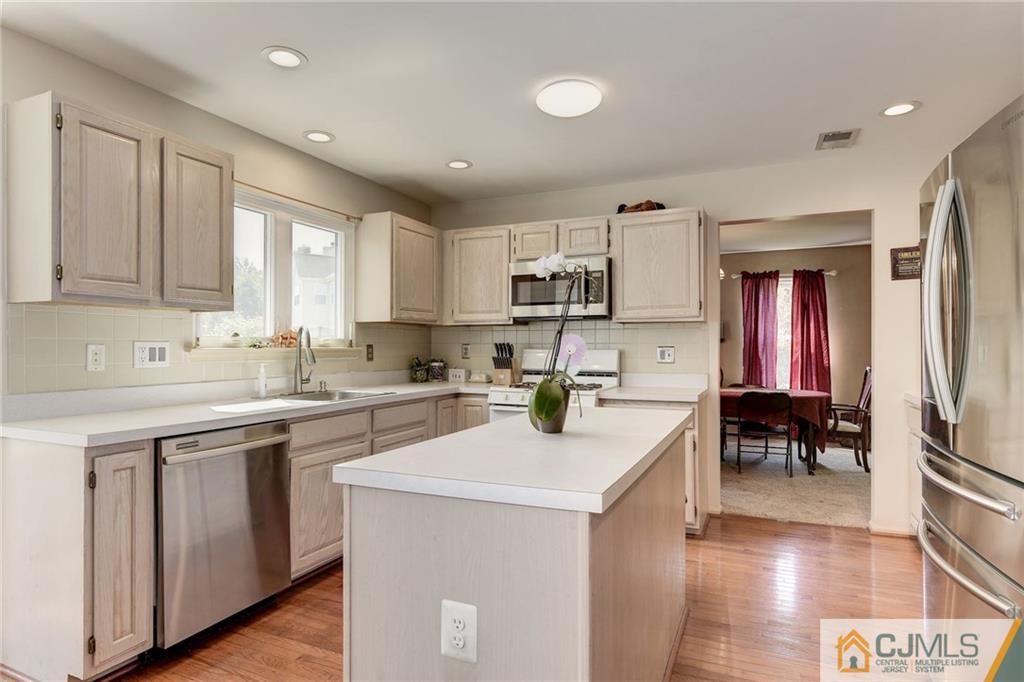 25 Crescent Road Old Bridge, NJ 08857 - Photo 9 of 25 a kitchen with a sink cabinets and window
