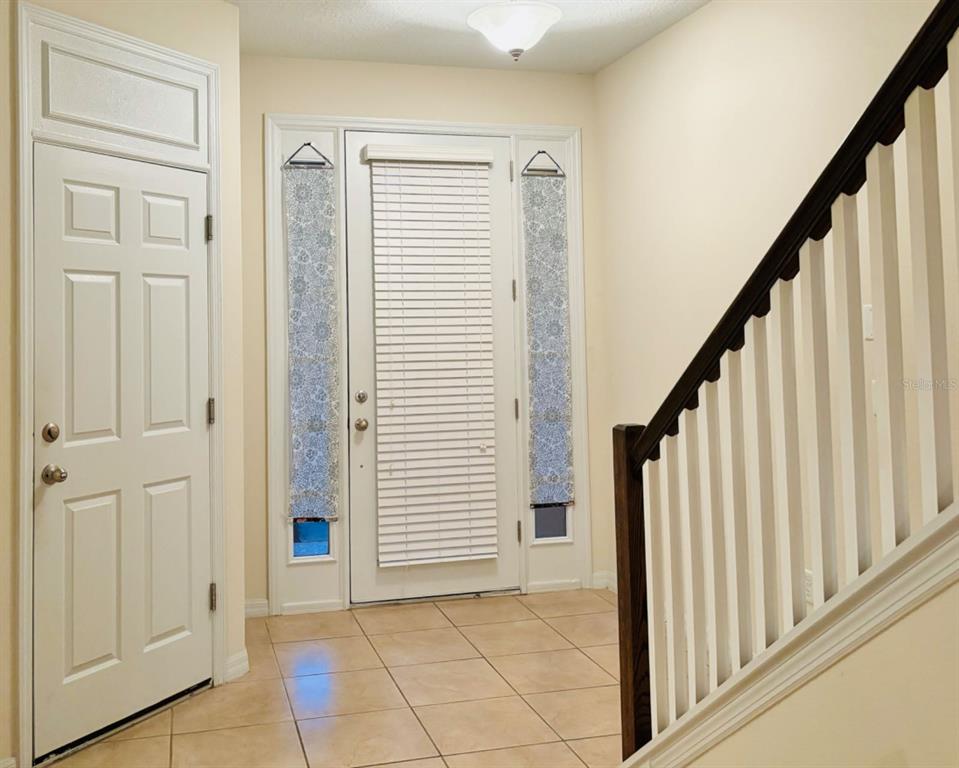 2144 Rookery Lane Sanford, FL 32773 - Photo 17 of 41 a view of a hallway with wooden floor and entryway