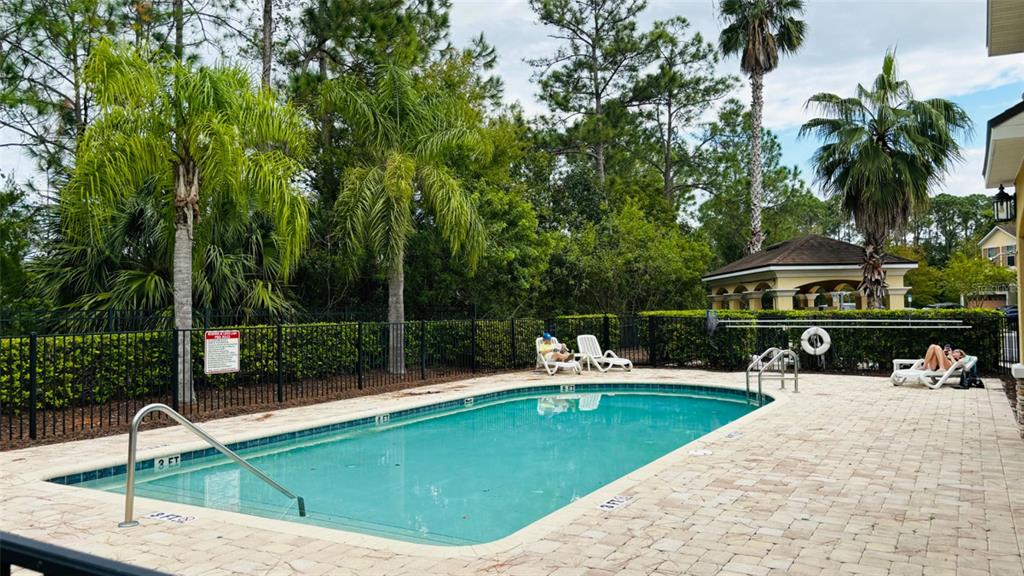 2144 Rookery Lane Sanford, FL 32773 - Photo 36 of 41 a view of a swimming pool with a patio