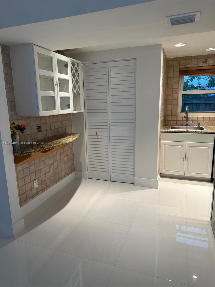 10916 Southwest 70th Terrace Miami, FL 33173 - Photo 11 of 39 a view of a kitchen with a sink cabinets and a kitchen