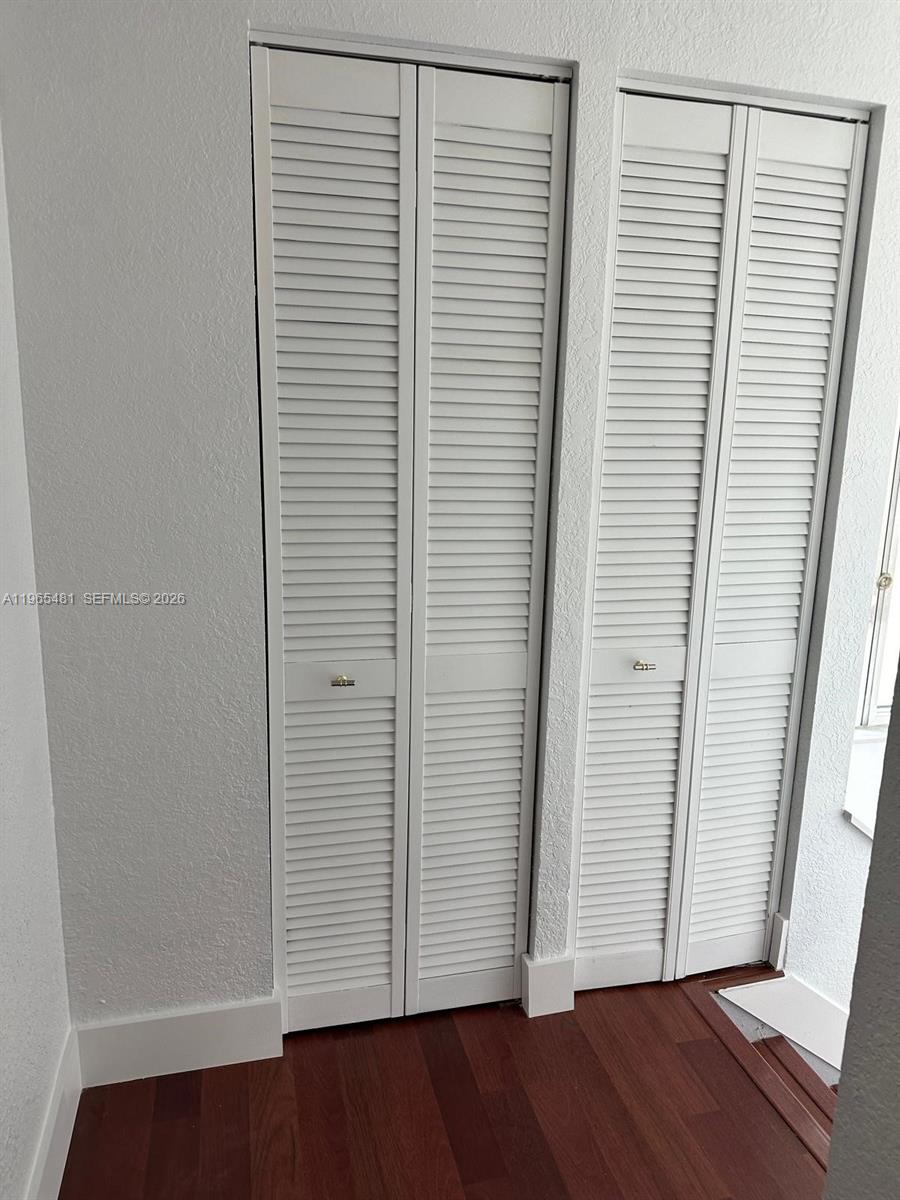 10916 Southwest 70th Terrace Miami, FL 33173 - Photo 17 of 39 an empty room with wooden floor