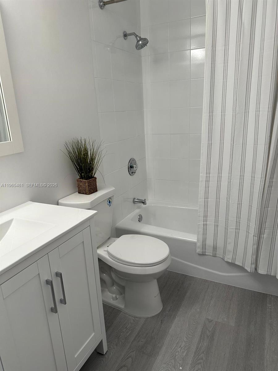 10916 Southwest 70th Terrace Miami, FL 33173 - Photo 23 of 39 a bathroom with a sink a toilet and shower