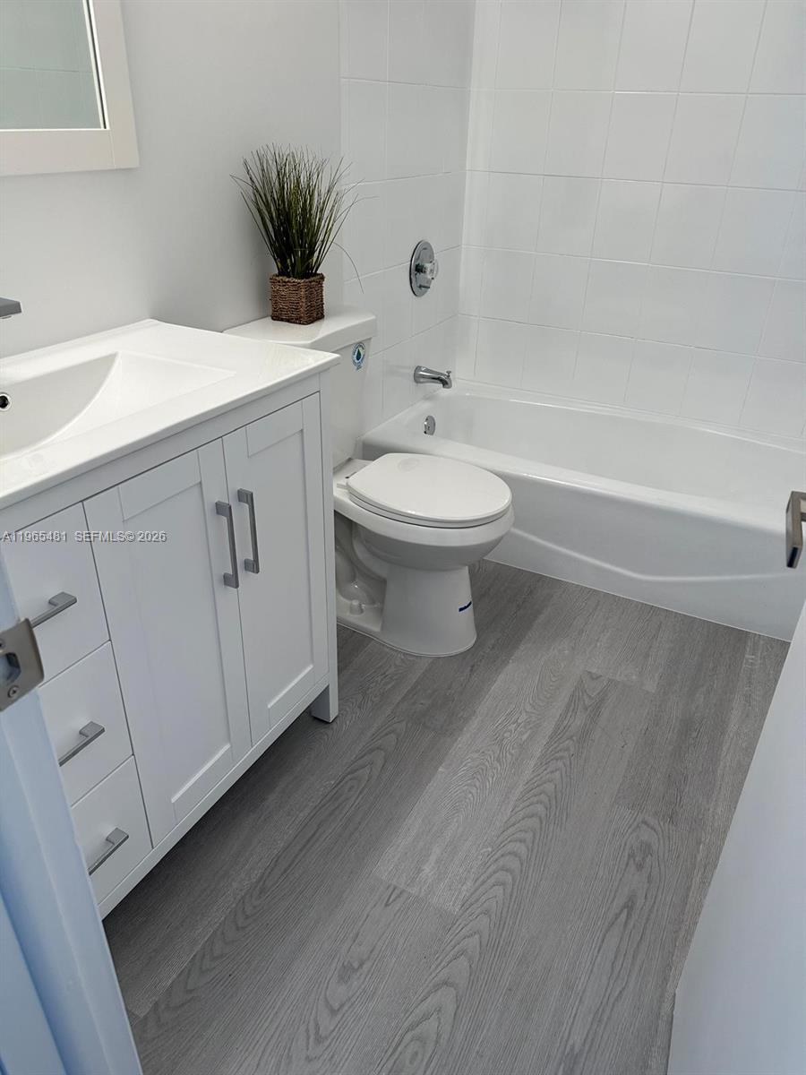 10916 Southwest 70th Terrace Miami, FL 33173 - Photo 27 of 39 a bathroom with a sink a toilet and shower