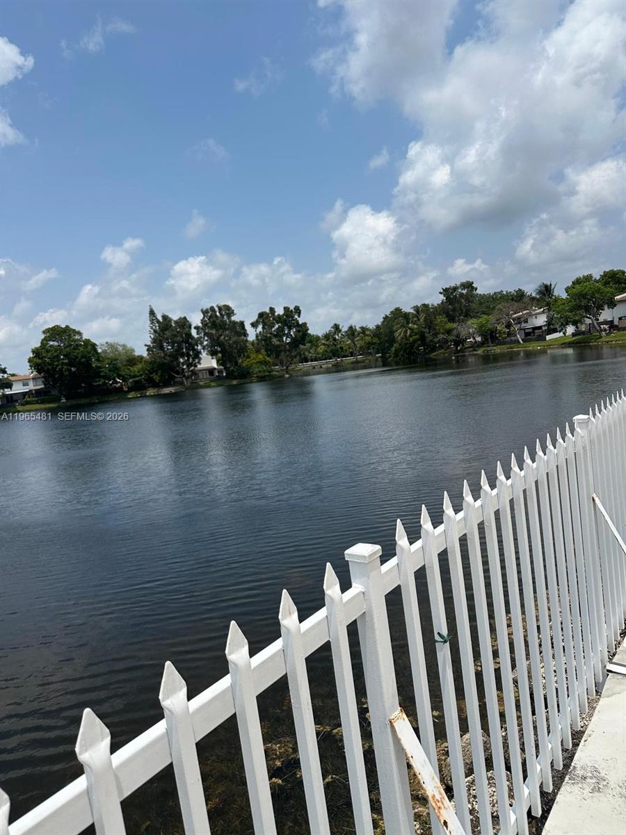 10916 Southwest 70th Terrace Miami, FL 33173 - Photo 33 of 39 a view of a lake with houses in the background