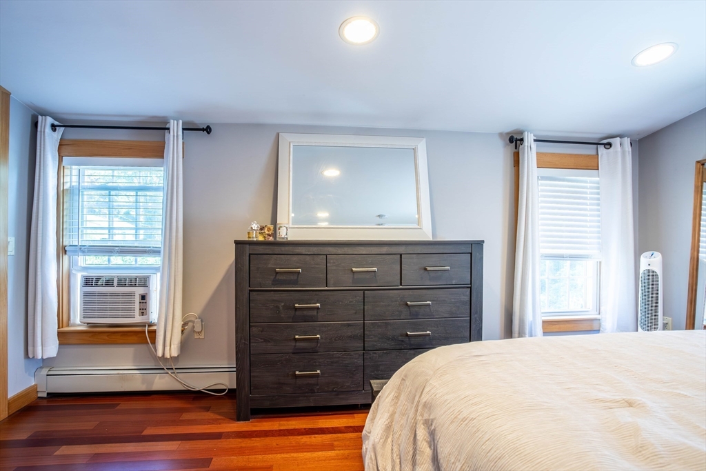 3642 Pawtucket Avenue Riverside, RI 02915 - Photo 24 of 39 a bedroom with a bed and a dresser