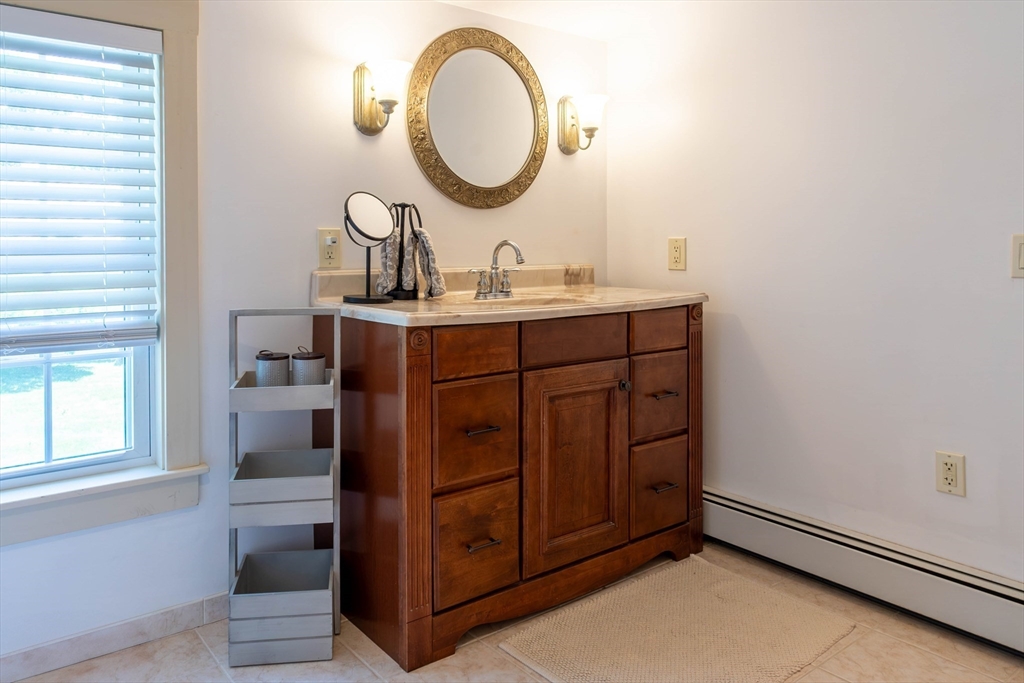 3642 Pawtucket Avenue Riverside, RI 02915 - Photo 36 of 39 a bathroom with a sink and a mirror