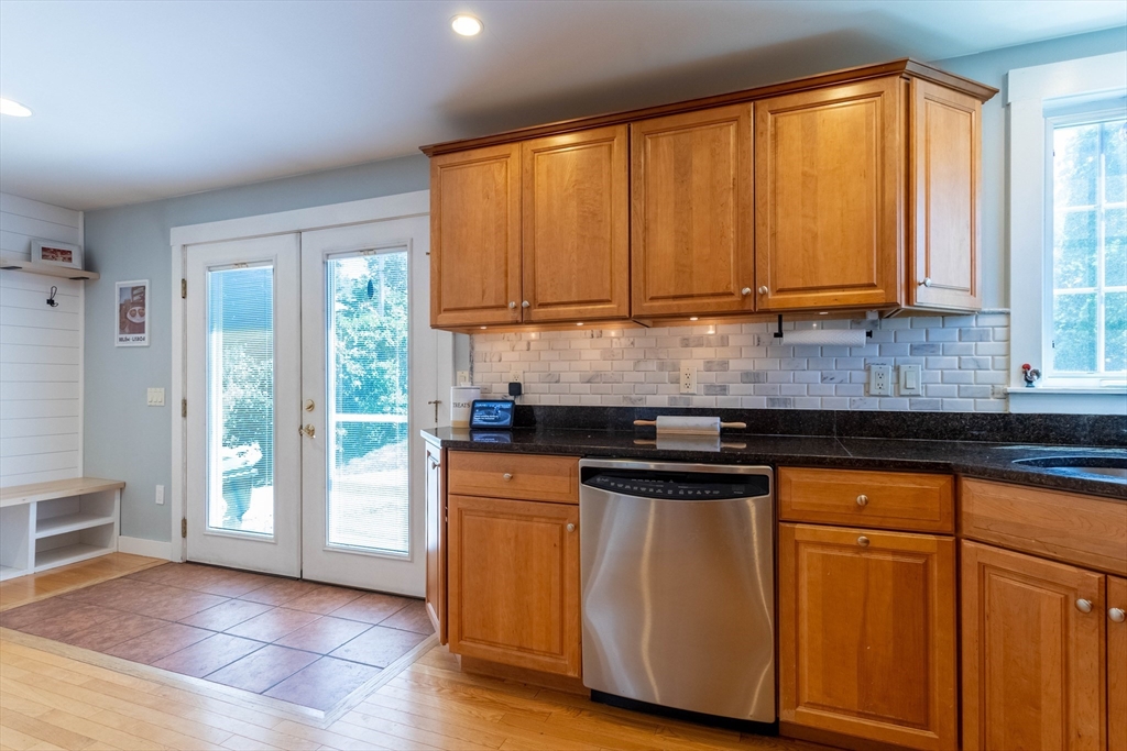 3642 Pawtucket Avenue Riverside, RI 02915 - Photo 6 of 39 a kitchen with stainless steel appliances granite countertop a refrigerator a sink a stove and white cabinets