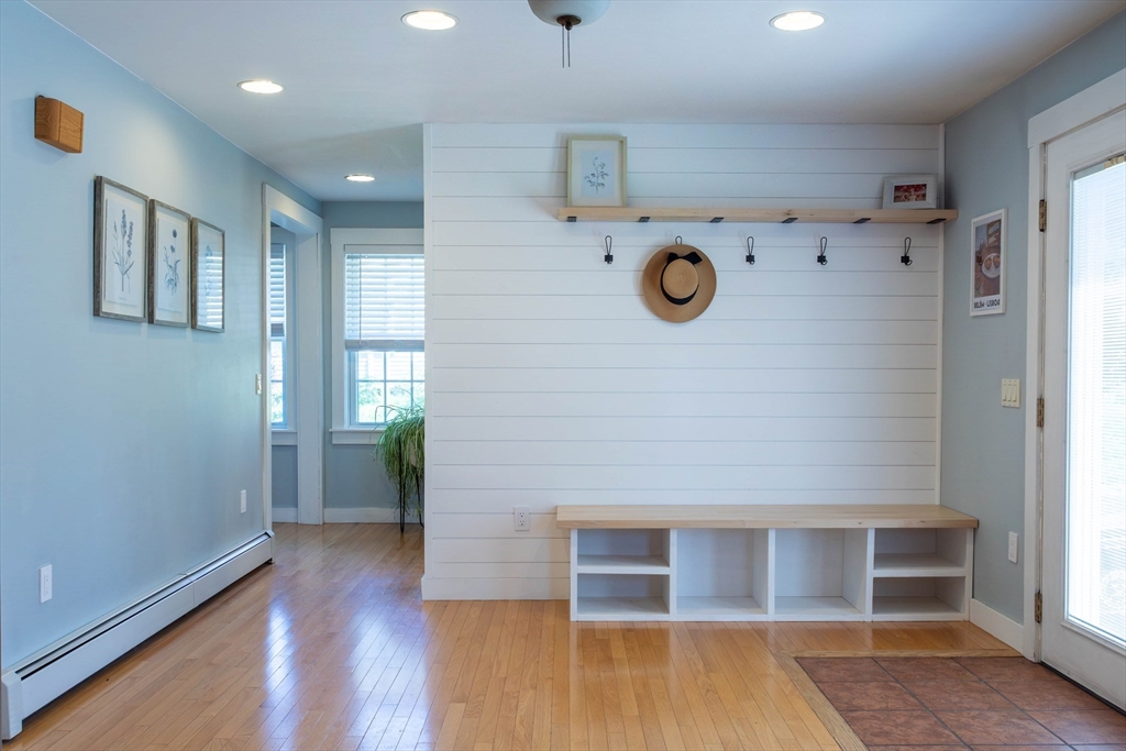 3642 Pawtucket Avenue Riverside, RI 02915 - Photo 8 of 39 a view of a hallway with wooden floor and entryway