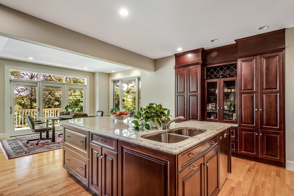 36 Sky View Circle Newton, MA 02459 - Photo 11 of 29 a kitchen that has a sink and chairs