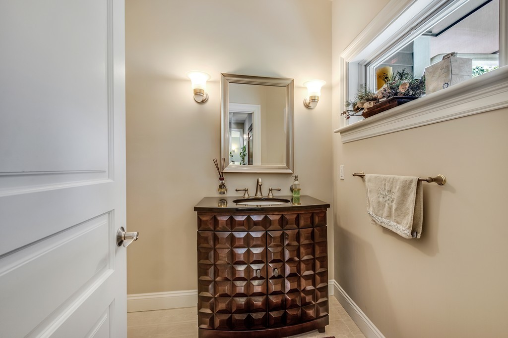 36 Sky View Circle Newton, MA 02459 - Photo 13 of 29 a bathroom with a mirror and a sink