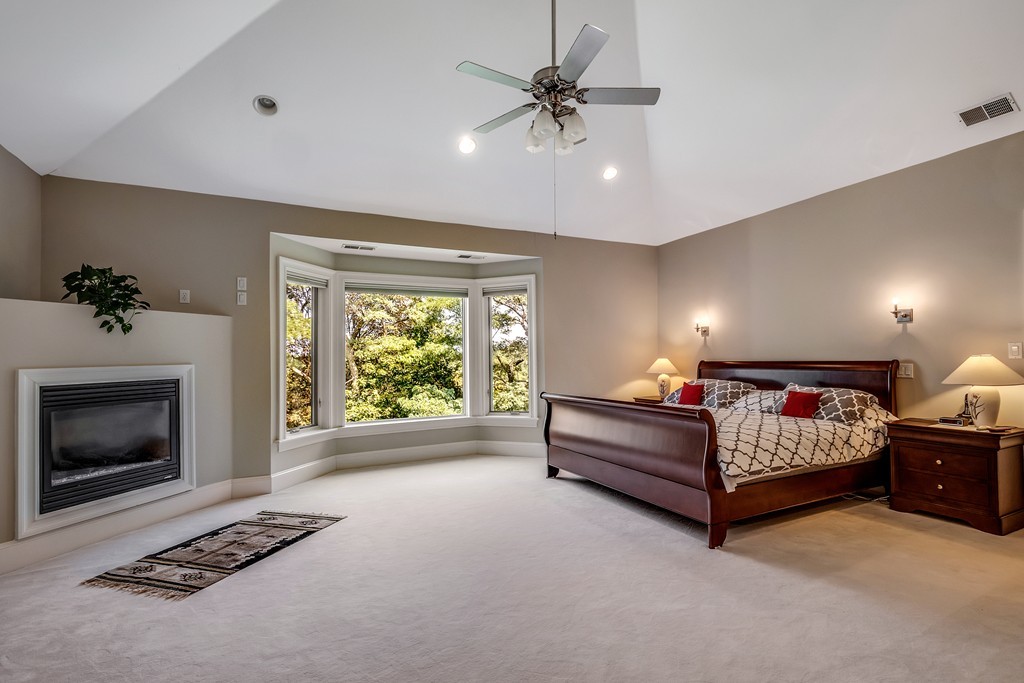 36 Sky View Circle Newton, MA 02459 - Photo 16 of 29 a bed room with a bed and a fireplace