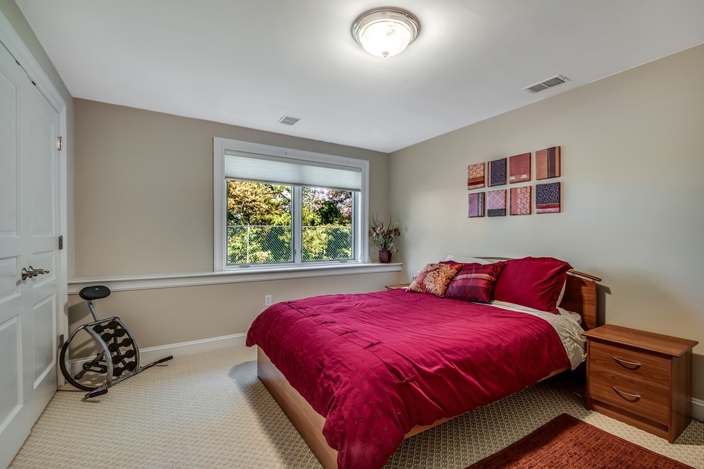 36 Sky View Circle Newton, MA 02459 - Photo 21 of 29 a bedroom with a bed and window