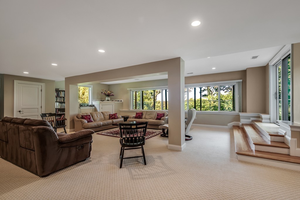 36 Sky View Circle Newton, MA 02459 - Photo 22 of 29 a living room with furniture and a large window