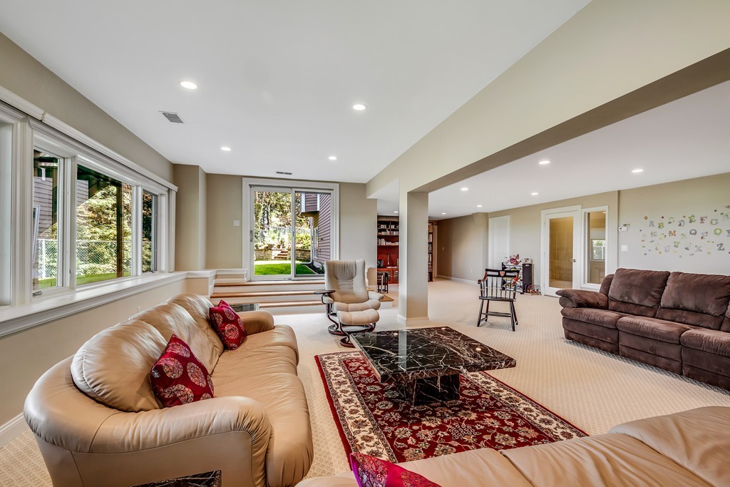 36 Sky View Circle Newton, MA 02459 - Photo 24 of 29 a living room with furniture and a large window