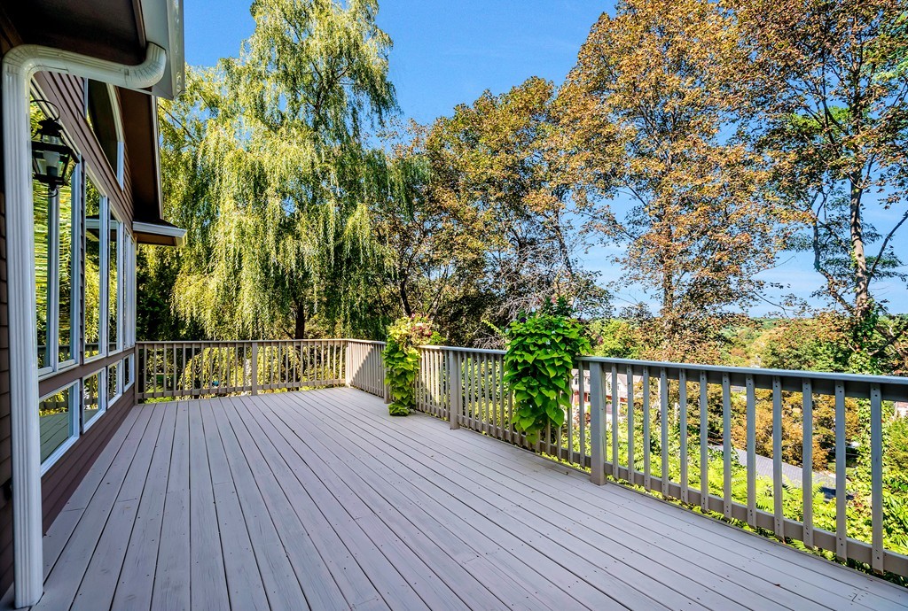 36 Sky View Circle Newton, MA 02459 - Photo 27 of 29 a view of balcony with wooden floor and fence