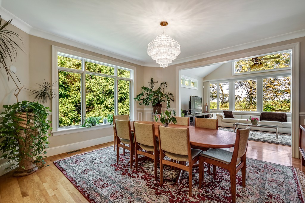 36 Sky View Circle Newton, MA 02459 - Photo 7 of 29 a dining room with wooden floor a chandelier a wooden table and chairs