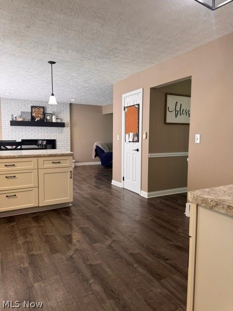 2760 Haines Road Madison, OH 44057 - Photo 15 of 33 Kitchen island with cream cabinetry, dark hardware, and a light-colored countertop