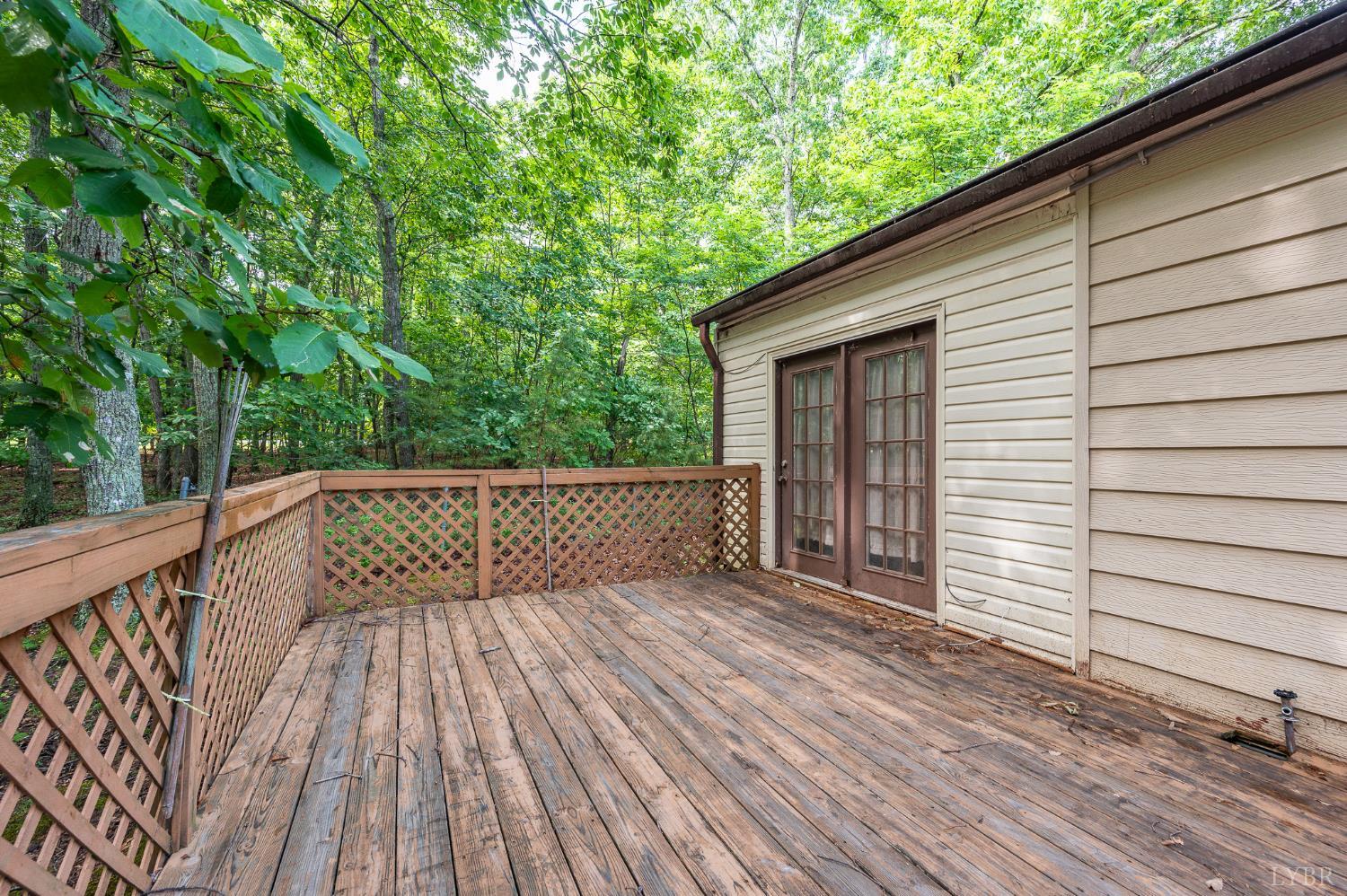 969 Hawkins Road Evington, VA 24550 - Photo 36 of 40 16x12 deck outside the Sunporch doors