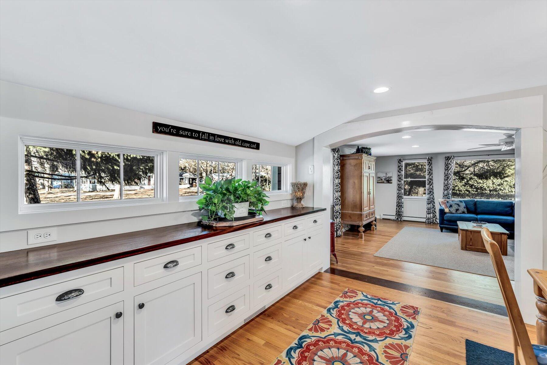 245 Lower County Road Harwich Port, MA 02646 - Photo 12 of 42 a large living room with wooden floor