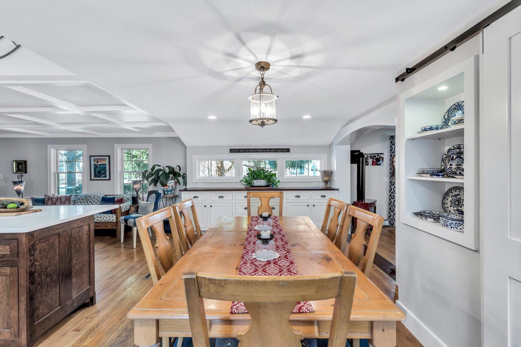 245 Lower County Road Harwich Port, MA 02646 - Photo 16 of 42 a view of a dining room with furniture window and wooden floor