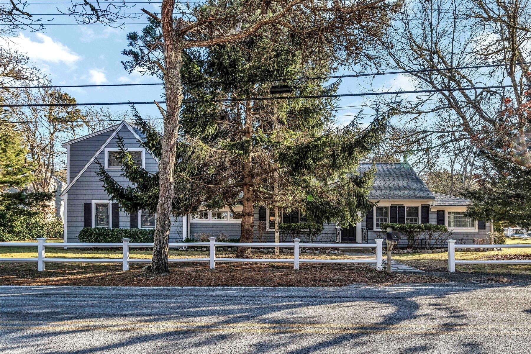245 Lower County Road Harwich Port, MA 02646 - Photo 3 of 42 a front view of a house with a porch