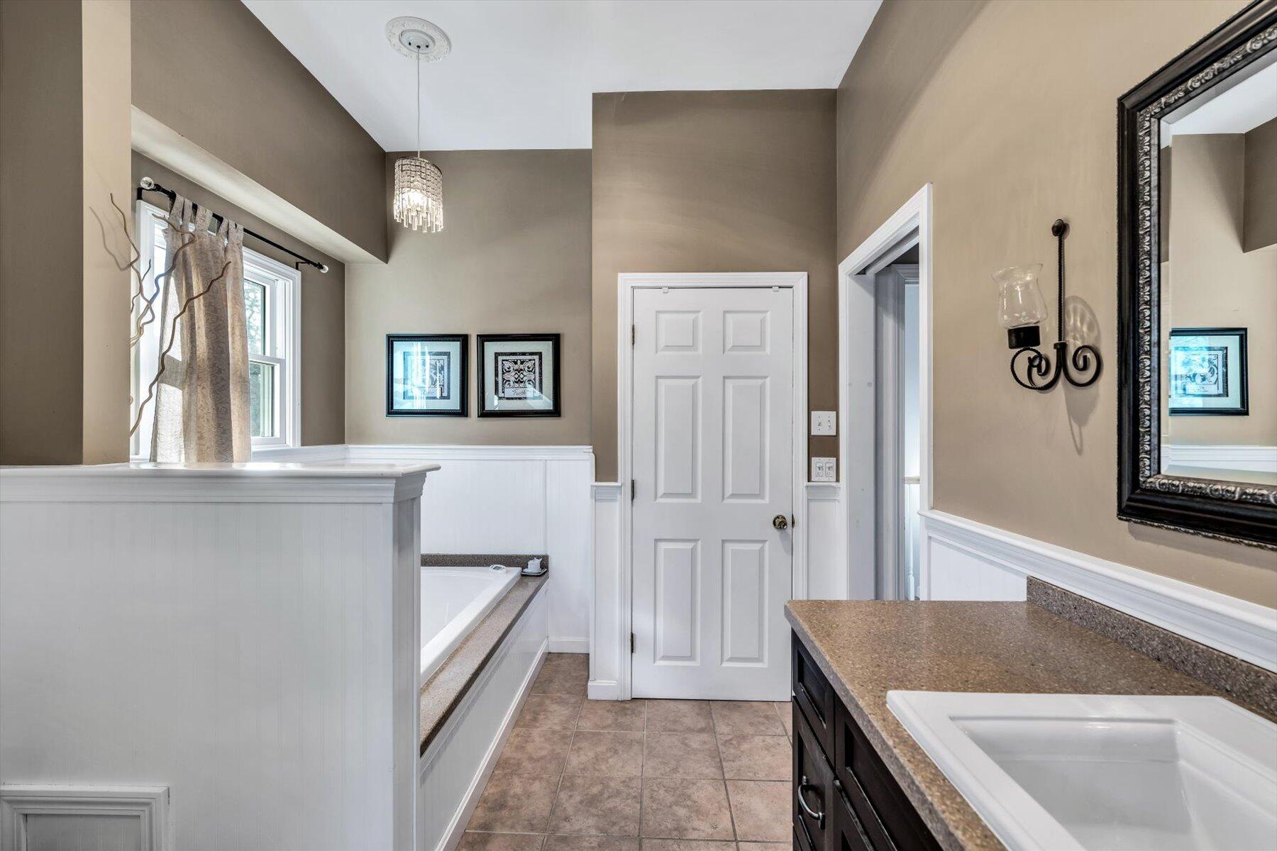 245 Lower County Road Harwich Port, MA 02646 - Photo 32 of 42 a kitchen with a sink and a refrigerator