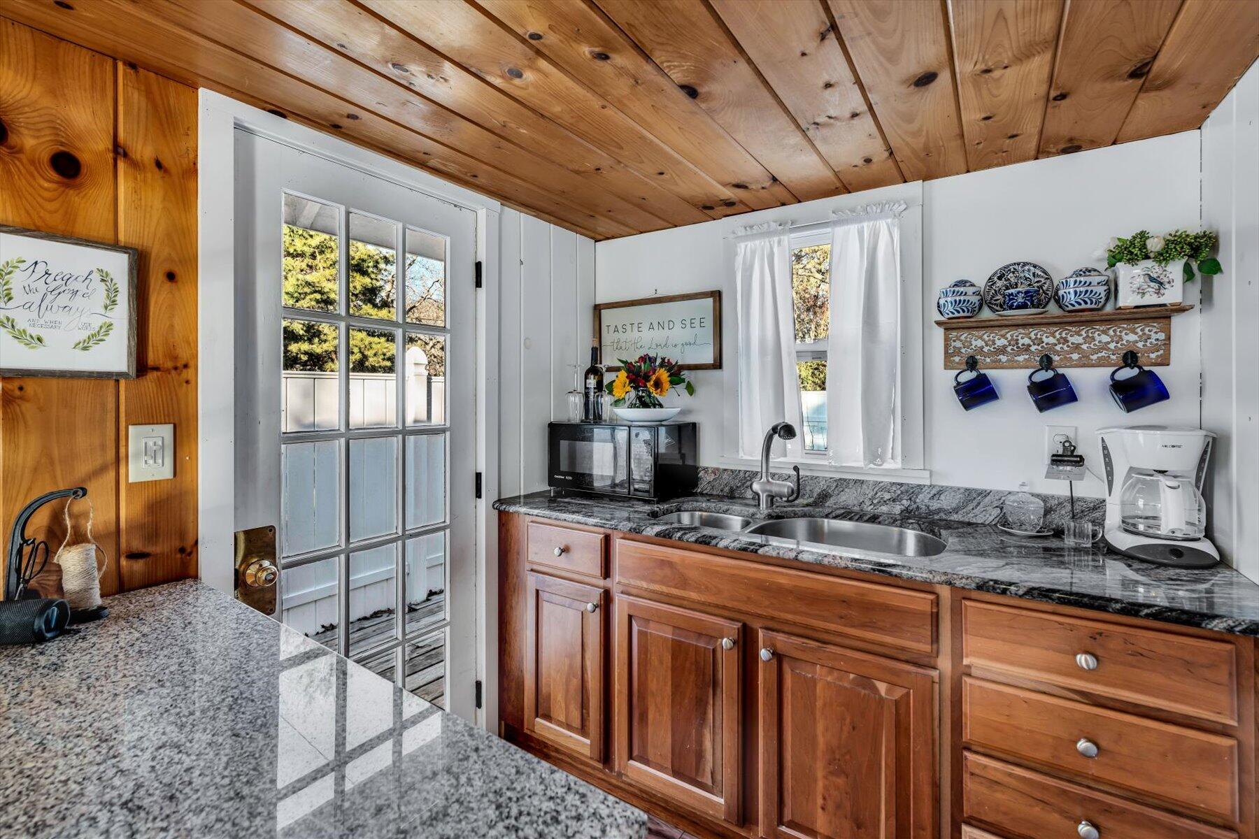 245 Lower County Road Harwich Port, MA 02646 - Photo 37 of 42 a kitchen with sink a window and appliances