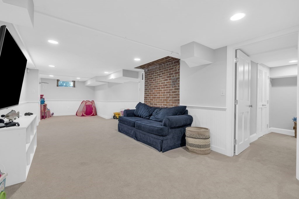 2 Hillcrest Road Marblehead, MA 01945 - Photo 32 of 38 a living room with furniture and a flat screen tv