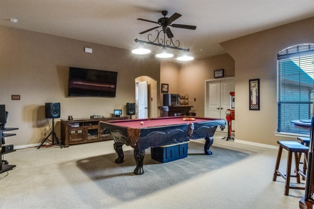 2810 Baker Street Sachse, TX 75048 - Photo 13 of 26 Recreation room featuring billiards, carpet, arched walkways, and a ceiling fan