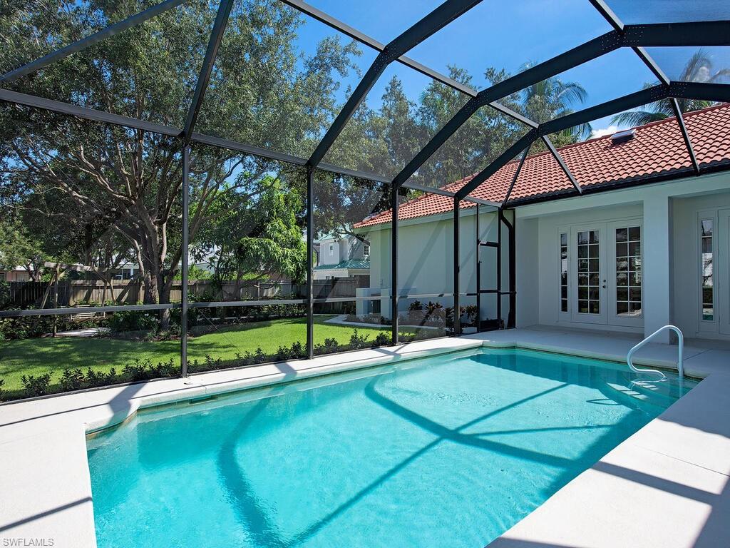431 1st Avenue North Naples, FL 34102 - Photo 3 of 19 a view of pool with a backyard