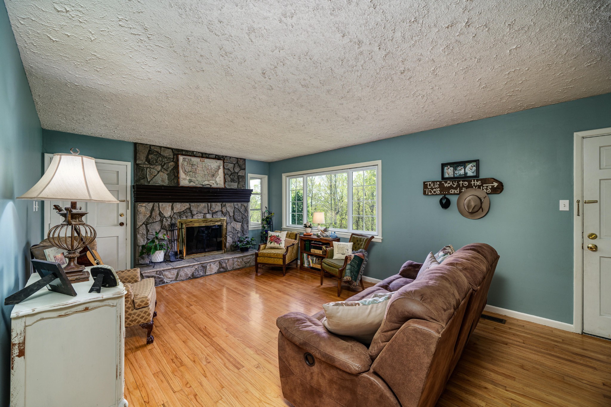 144 Meister Hills Road Deer Lodge, TN 37726 - Photo 2 of 40 a living room with furniture and a fireplace