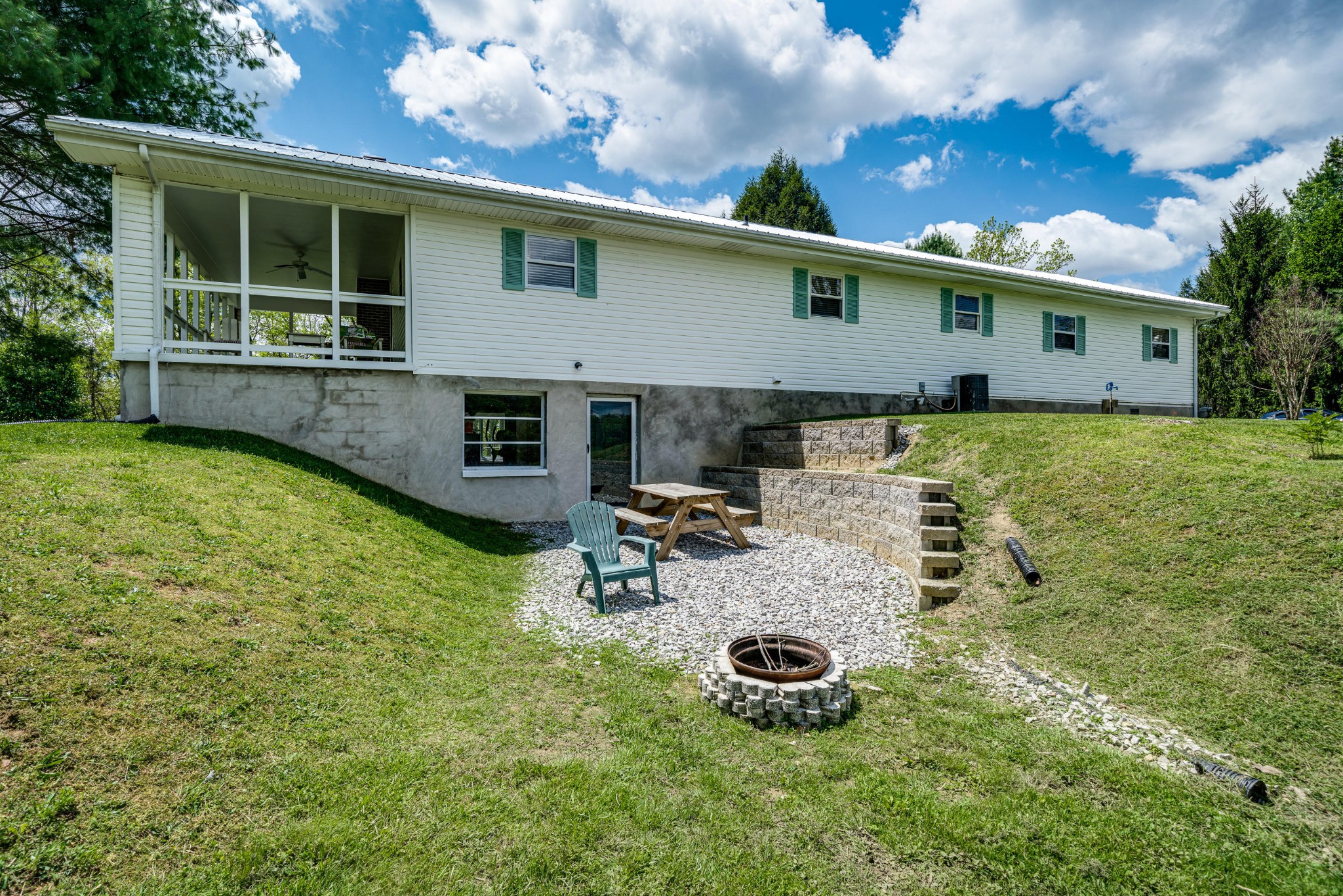 144 Meister Hills Road Deer Lodge, TN 37726 - Photo 28 of 40 a view of a house with backyard and sitting area