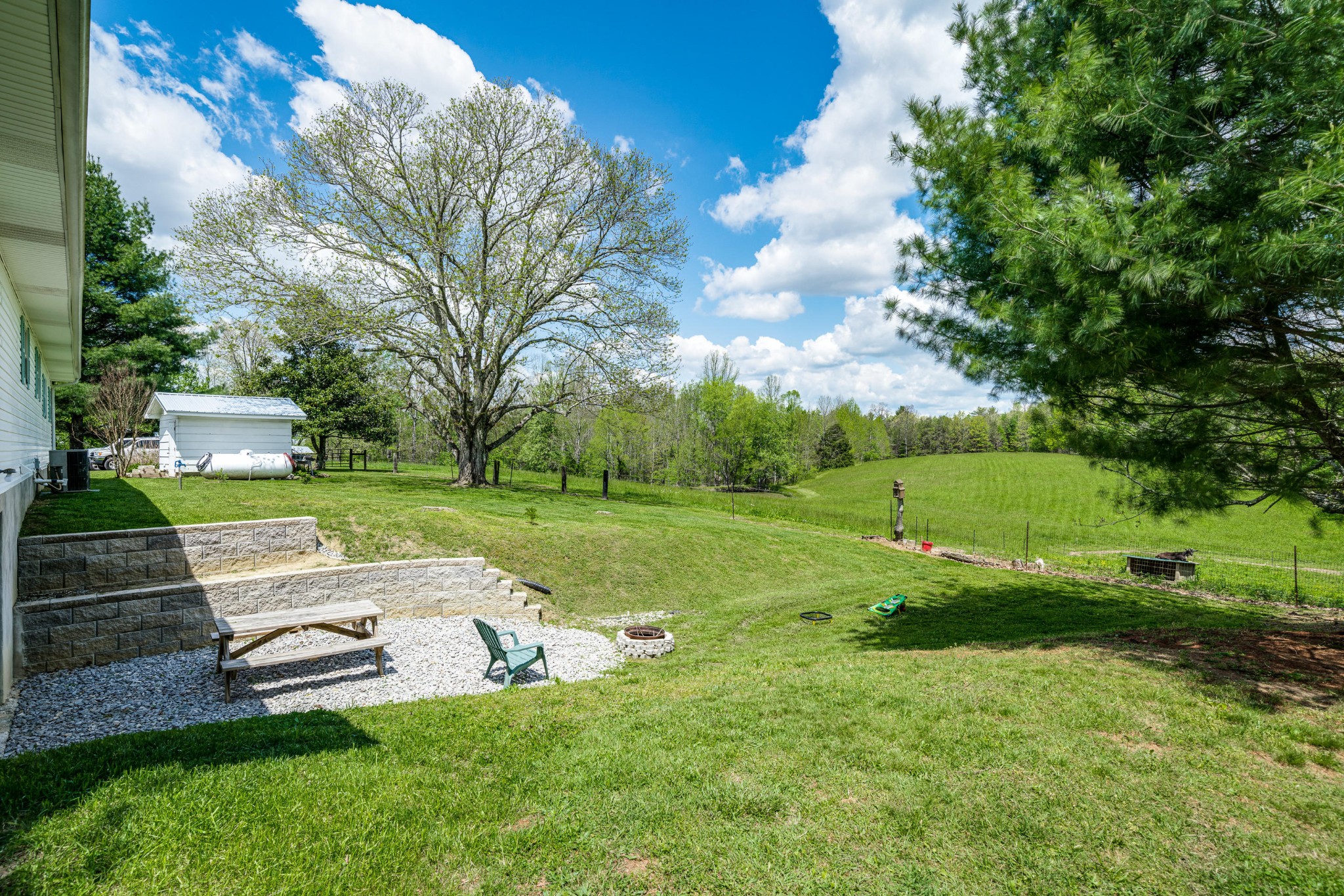 144 Meister Hills Road Deer Lodge, TN 37726 - Photo 29 of 40 a view of backyard with a garden and entertaining space