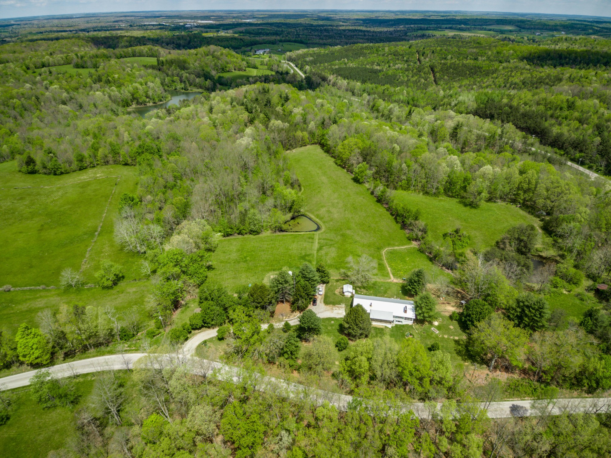 144 Meister Hills Road Deer Lodge, TN 37726 - Photo 32 of 40 a view of a garden with a building