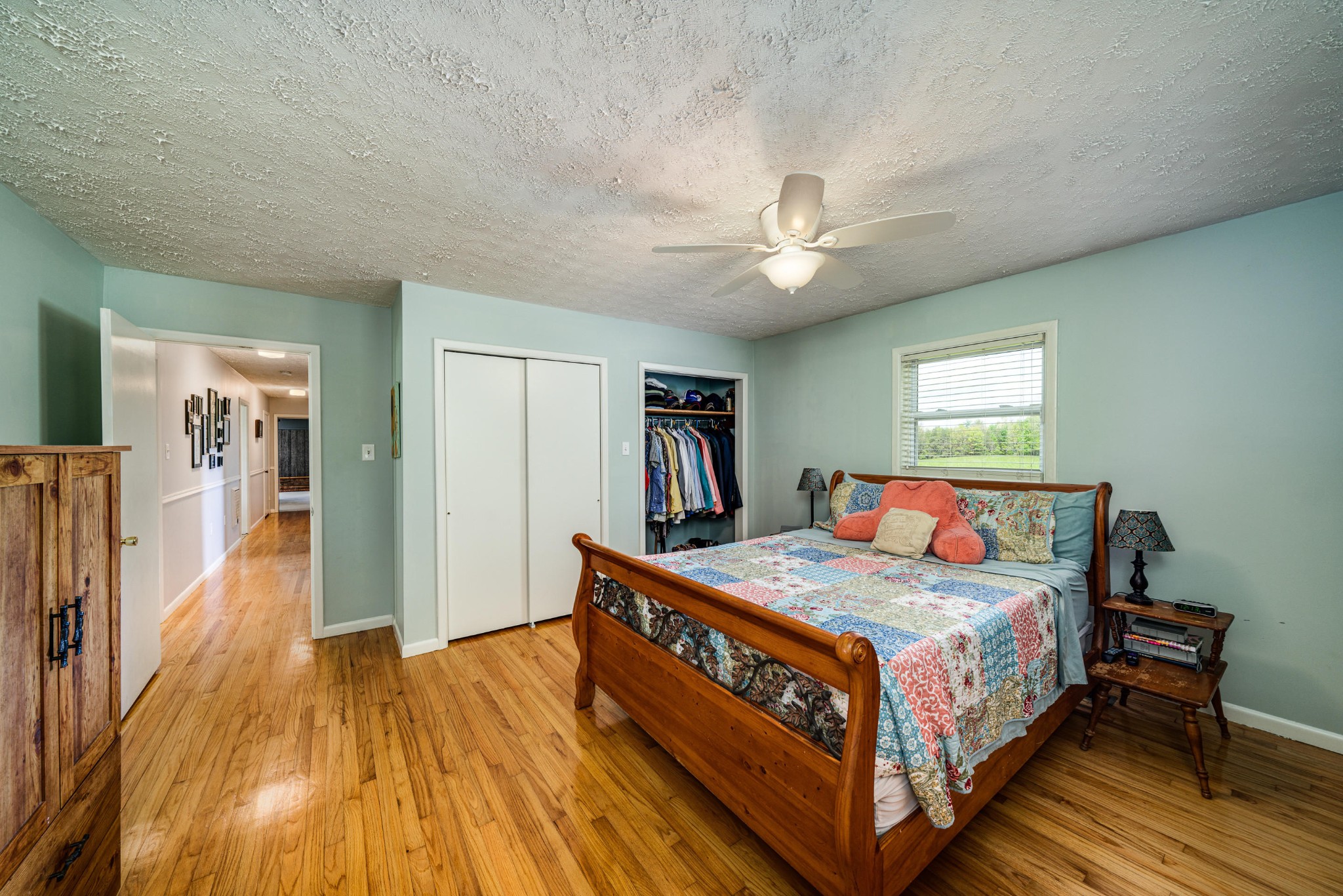 144 Meister Hills Road Deer Lodge, TN 37726 - Photo 10 of 40 a bedroom with a bed and a chandelier