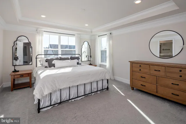 a bed room with a bed and a dresser