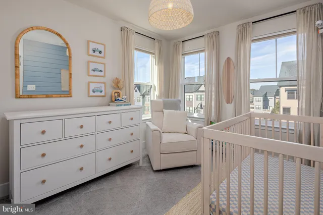 a bedroom with windows and balcony