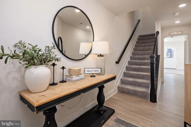 a bathroom with a sink mirror and vanity