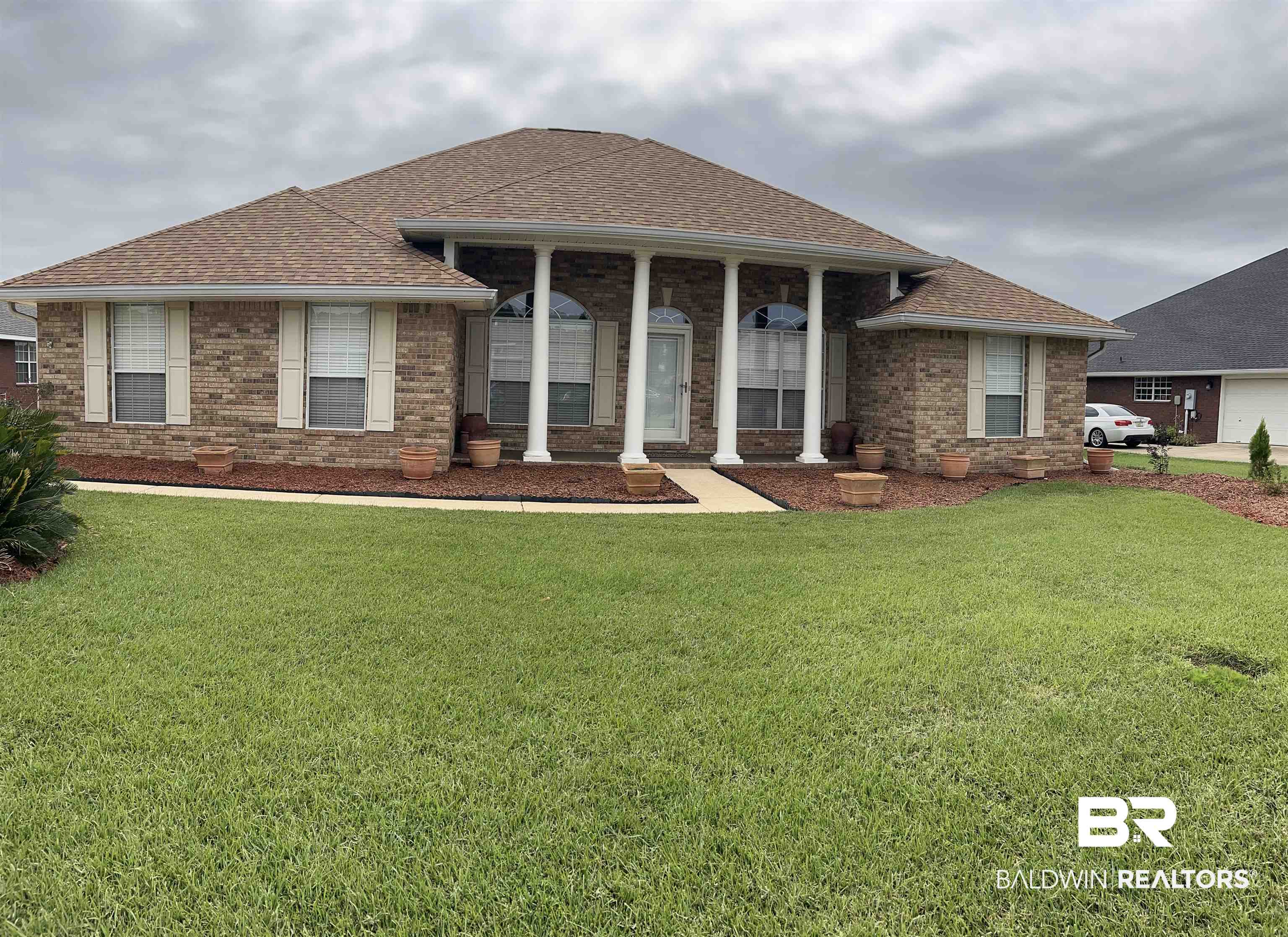 421 Collinwood Loop Foley, AL 36535 - Photo 3 of 62 View of front facade with a front yard