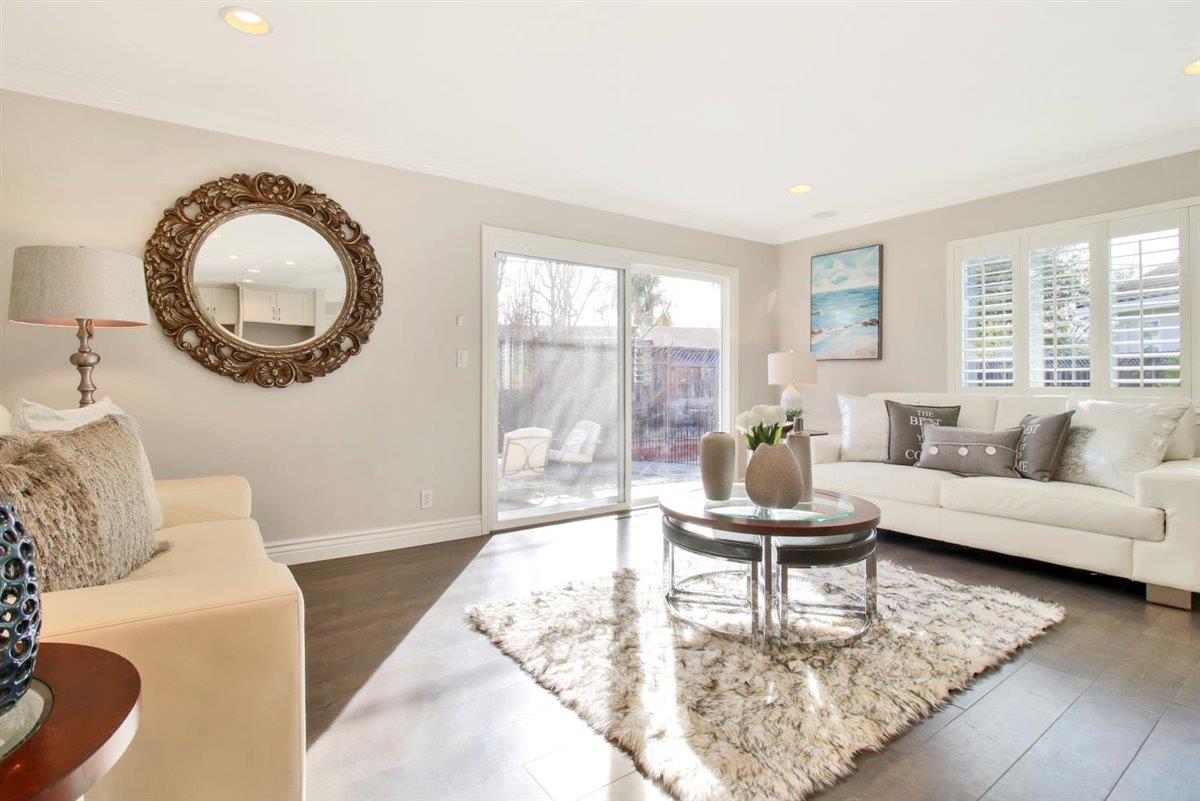 10846 Willowbrook Way Cupertino, CA 95014 - Photo 15 of 48 a living room with a couch and a table