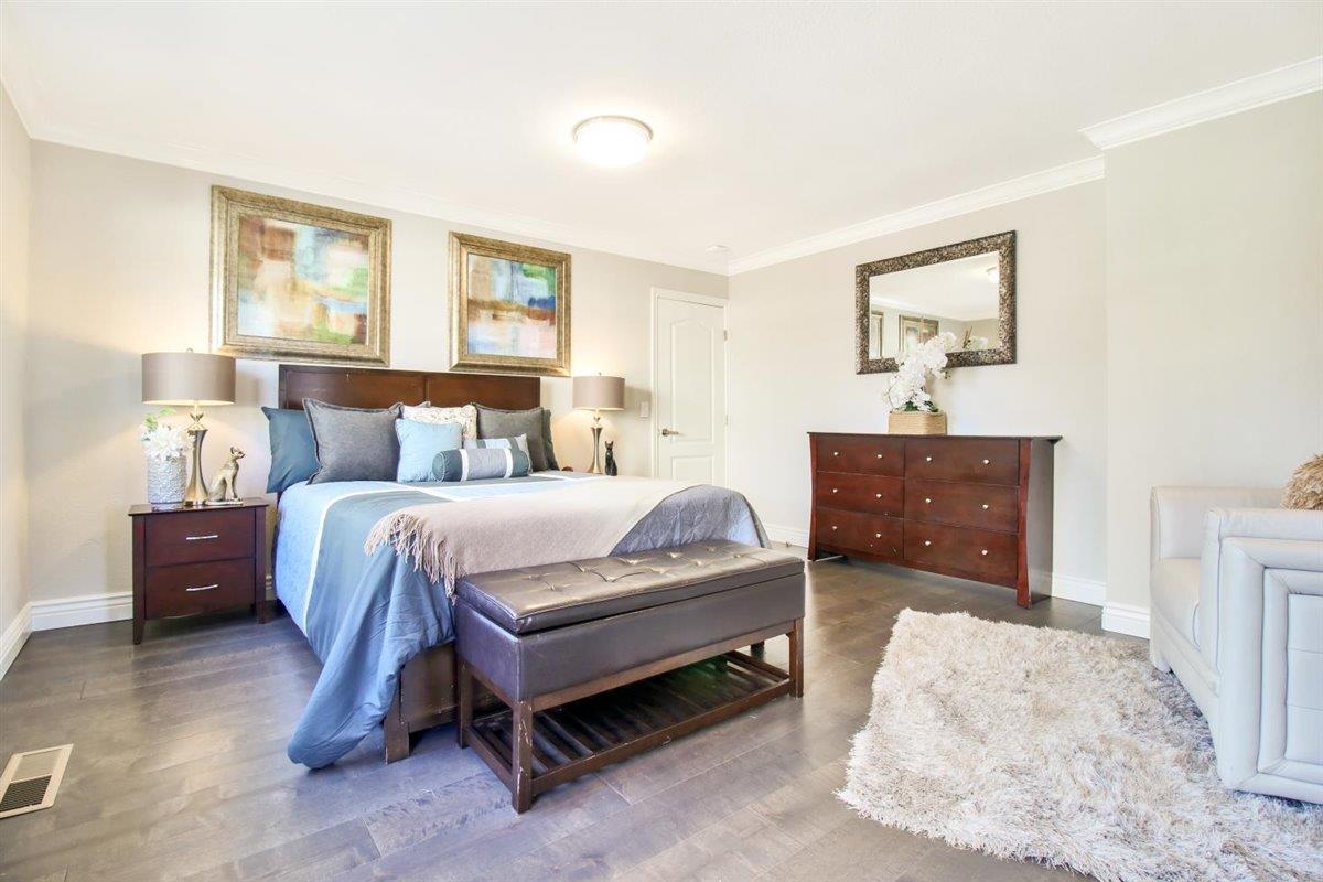 10846 Willowbrook Way Cupertino, CA 95014 - Photo 18 of 48 a spacious bedroom with a bed and window