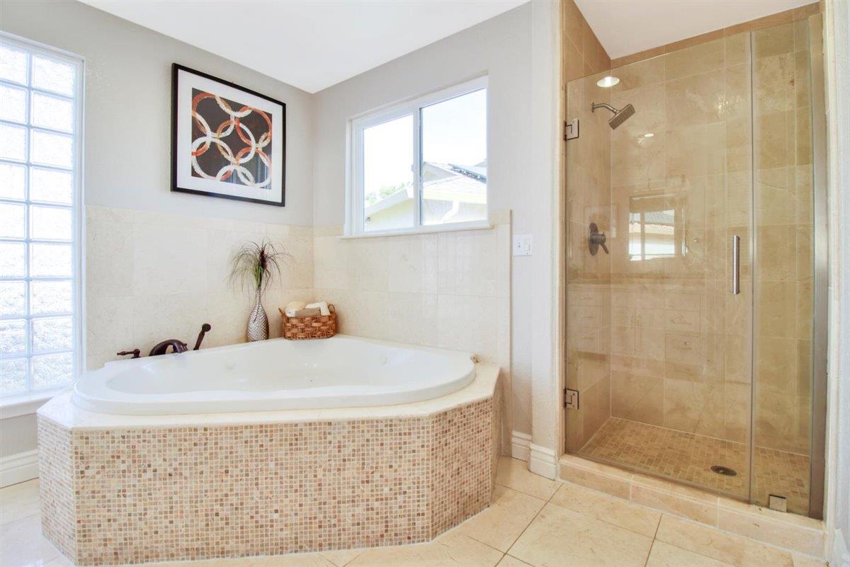 10846 Willowbrook Way Cupertino, CA 95014 - Photo 21 of 48 a bathroom with a tub a sink and shower